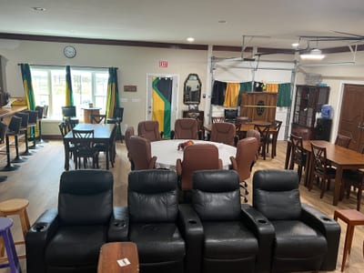 Carib Comfort shared lounge with recliner seating and dining tables