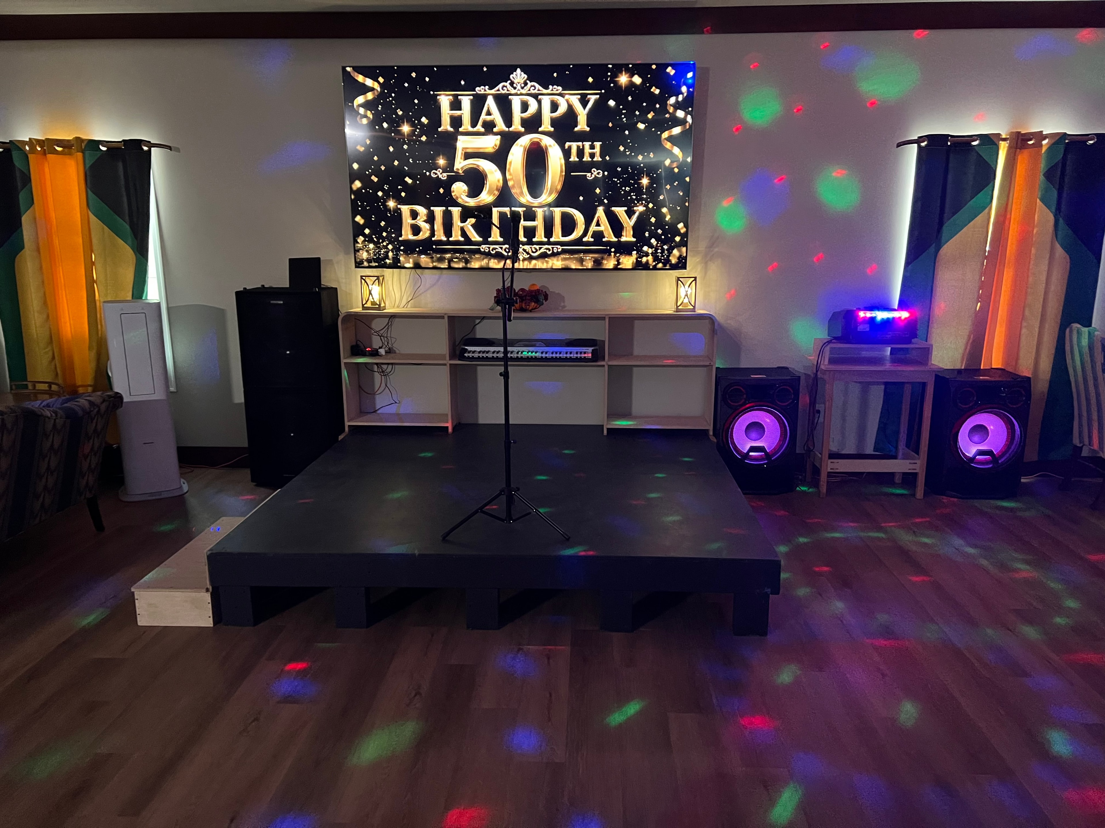 Entertainment lounge with stage, party lighting and 50th birthday display