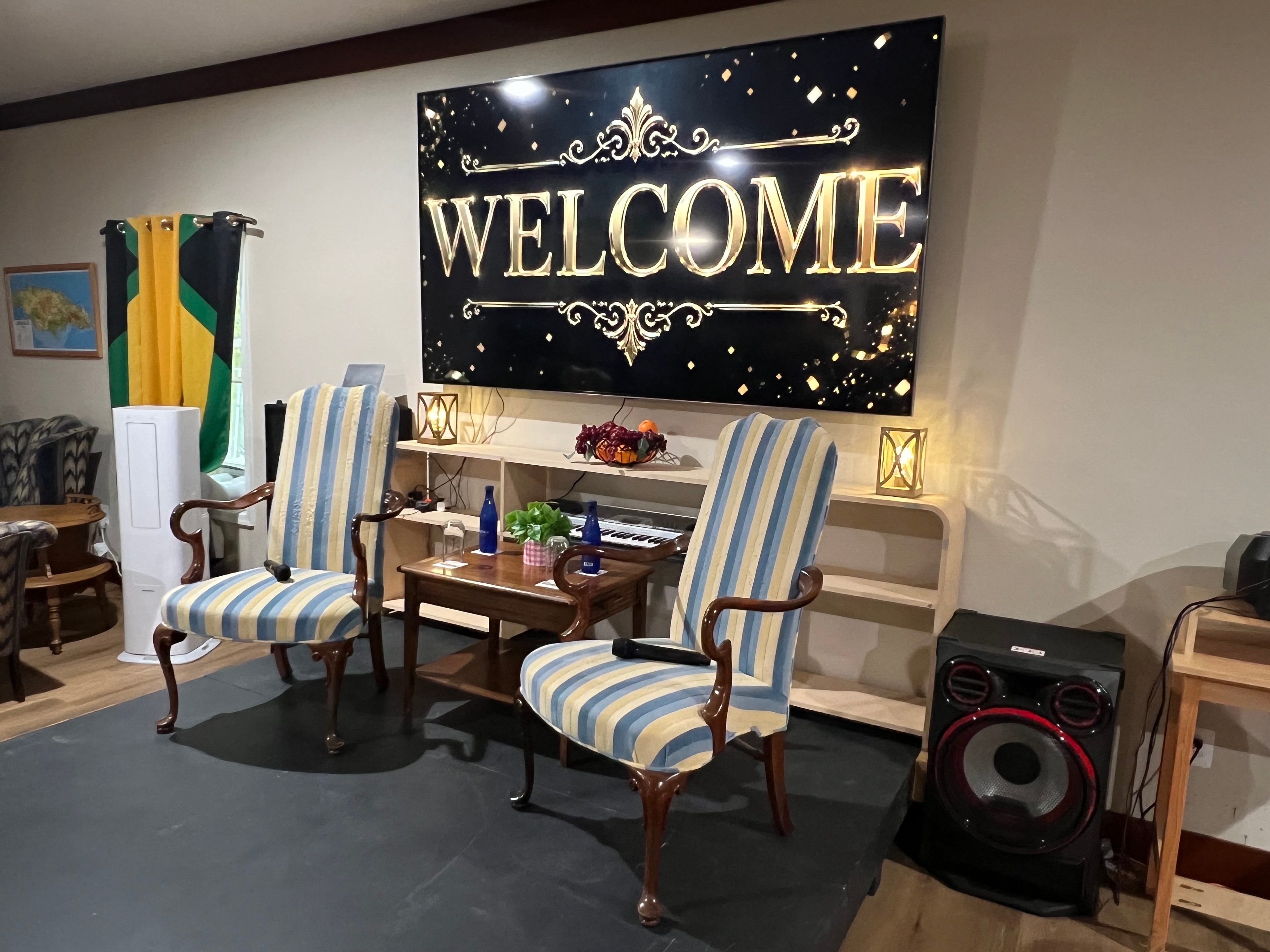 Welcome sign display with elegant striped chairs in the Caribbean lounge