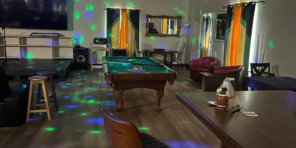 Entertainment room with pool table and party lighting