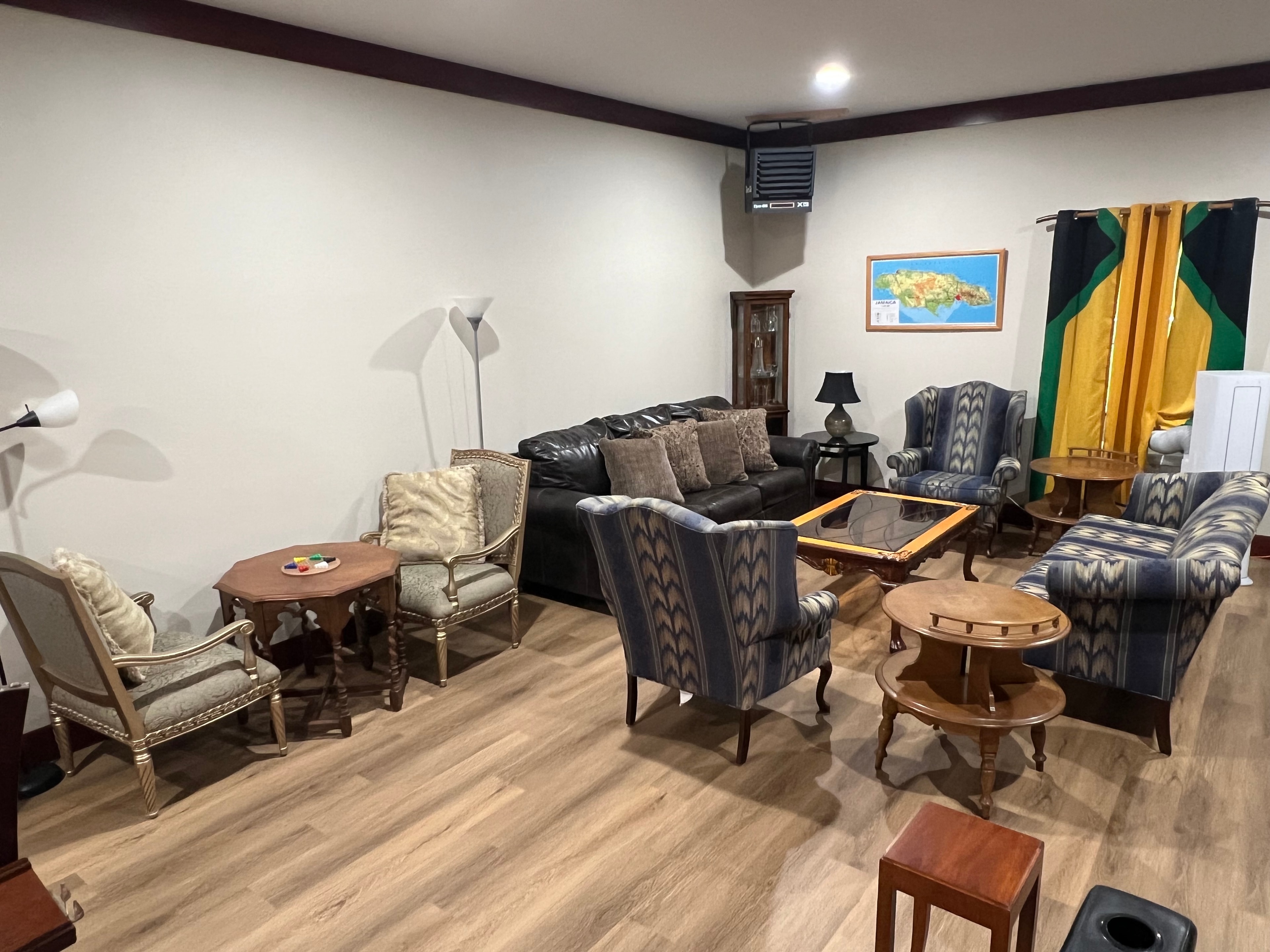 Carib Comfort lounge seating area with Jamaican decor