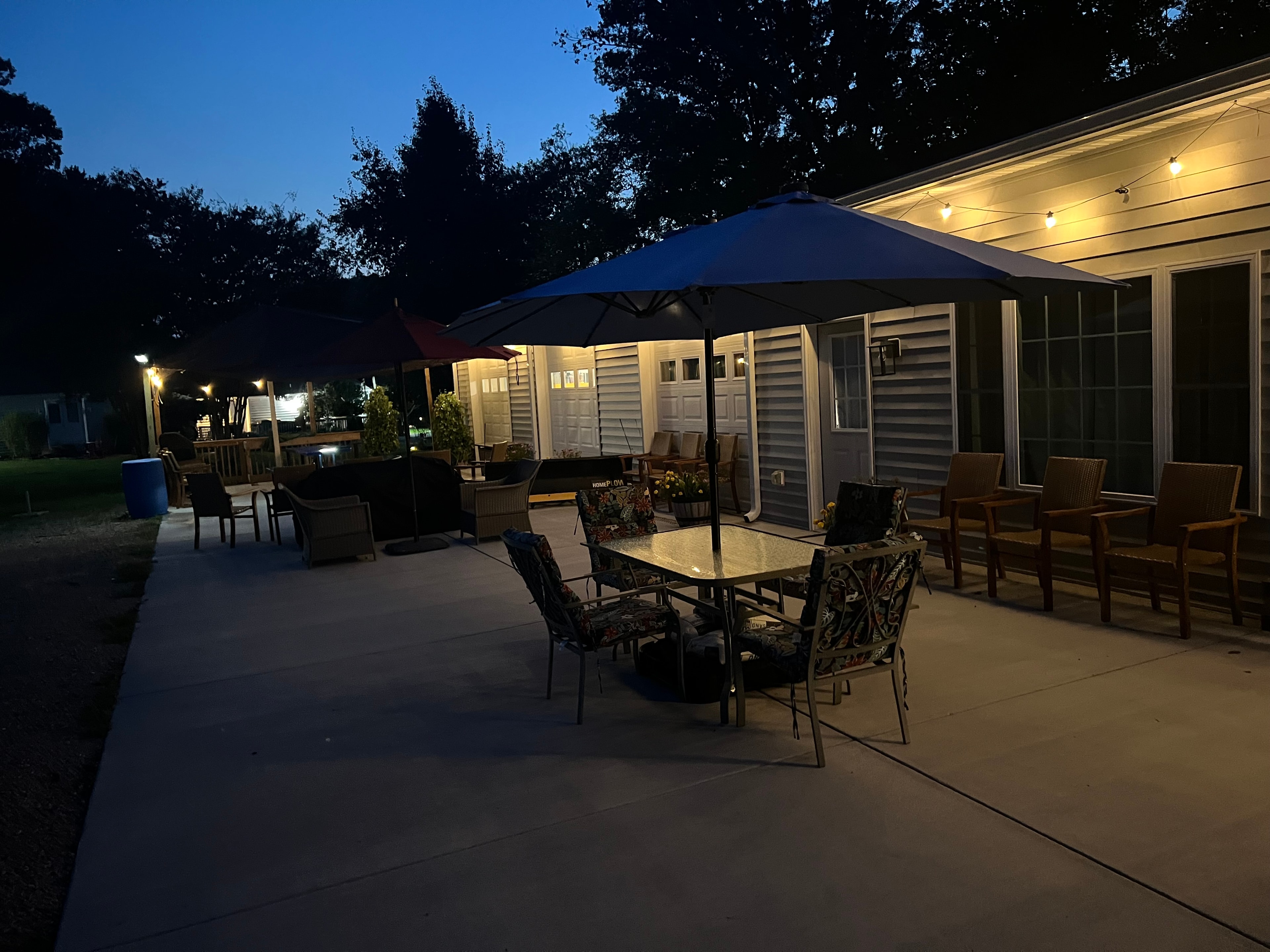 Carib Comfort outdoor patio with evening lighting