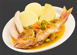 Carib Comfort breakfast — steamed red snapper with boiled banana and dumplings