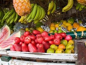 Carib Comfort breakfast — Caribbean market fruits including ackee, bananas and tropical produce
