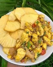 Carib Comfort breakfast — ackee and saltfish with fried dumplings and boiled banana