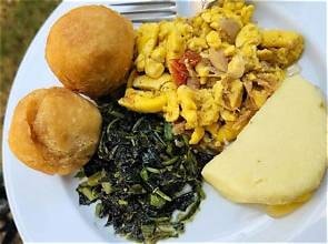 Carib Comfort breakfast — ackee, callaloo, fried dumplings and boiled banana plate