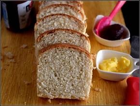 Carib Comfort breakfast — sliced hard dough bread with butter and jam